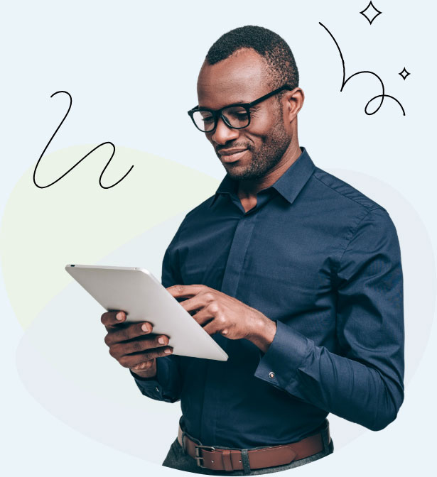 A man wearing glasses is using a tablet computer to browse the internet or perform various tasks.